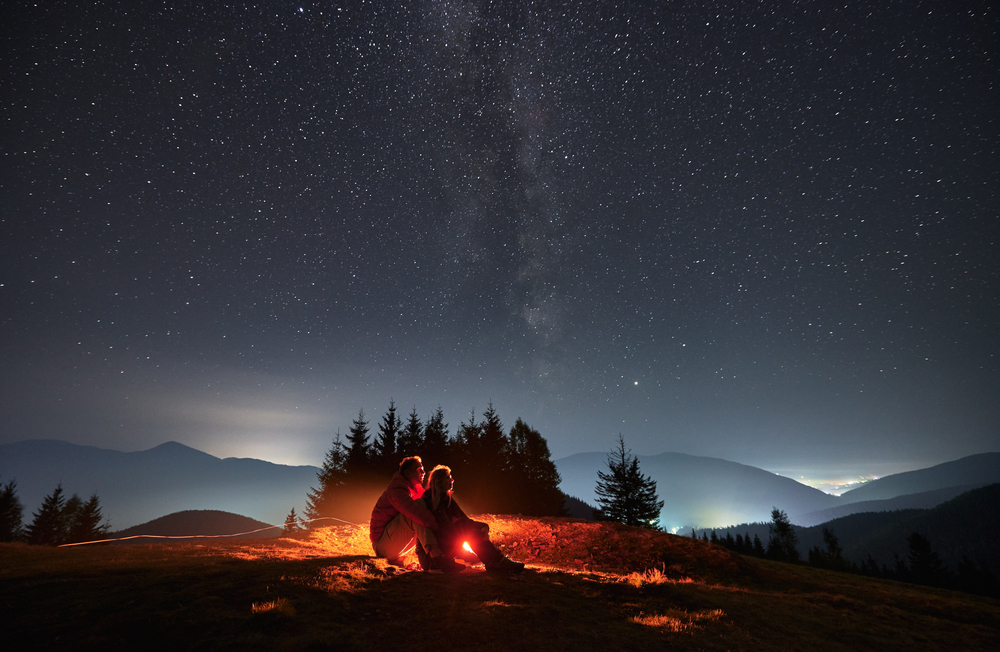 a couple enjoying the night view in the outback